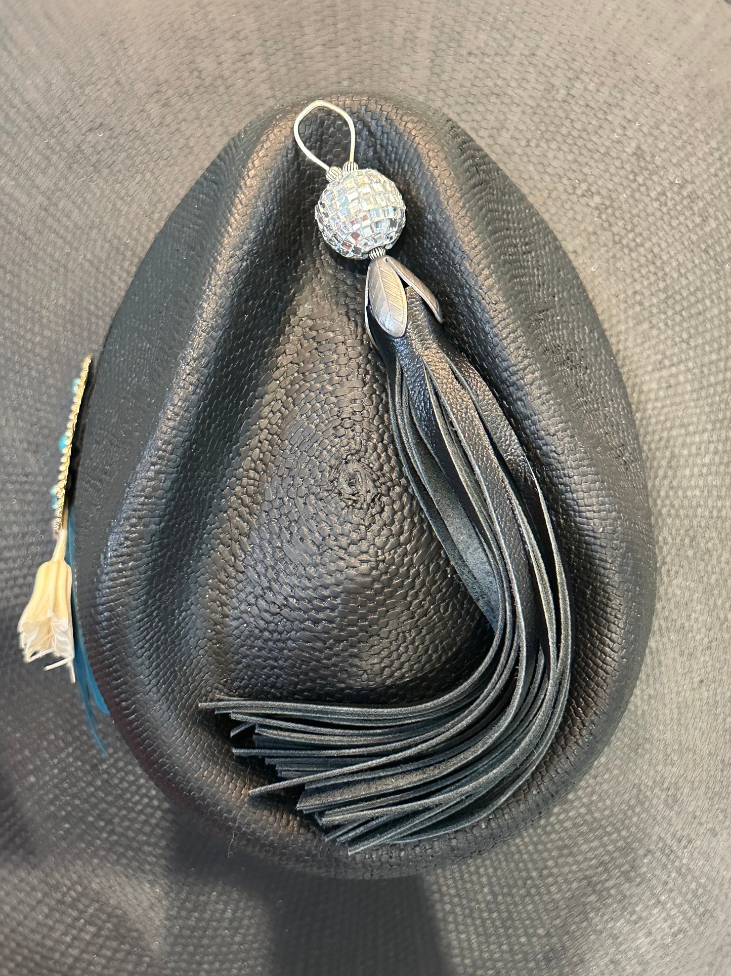 Black leather tassel with a disco ball
